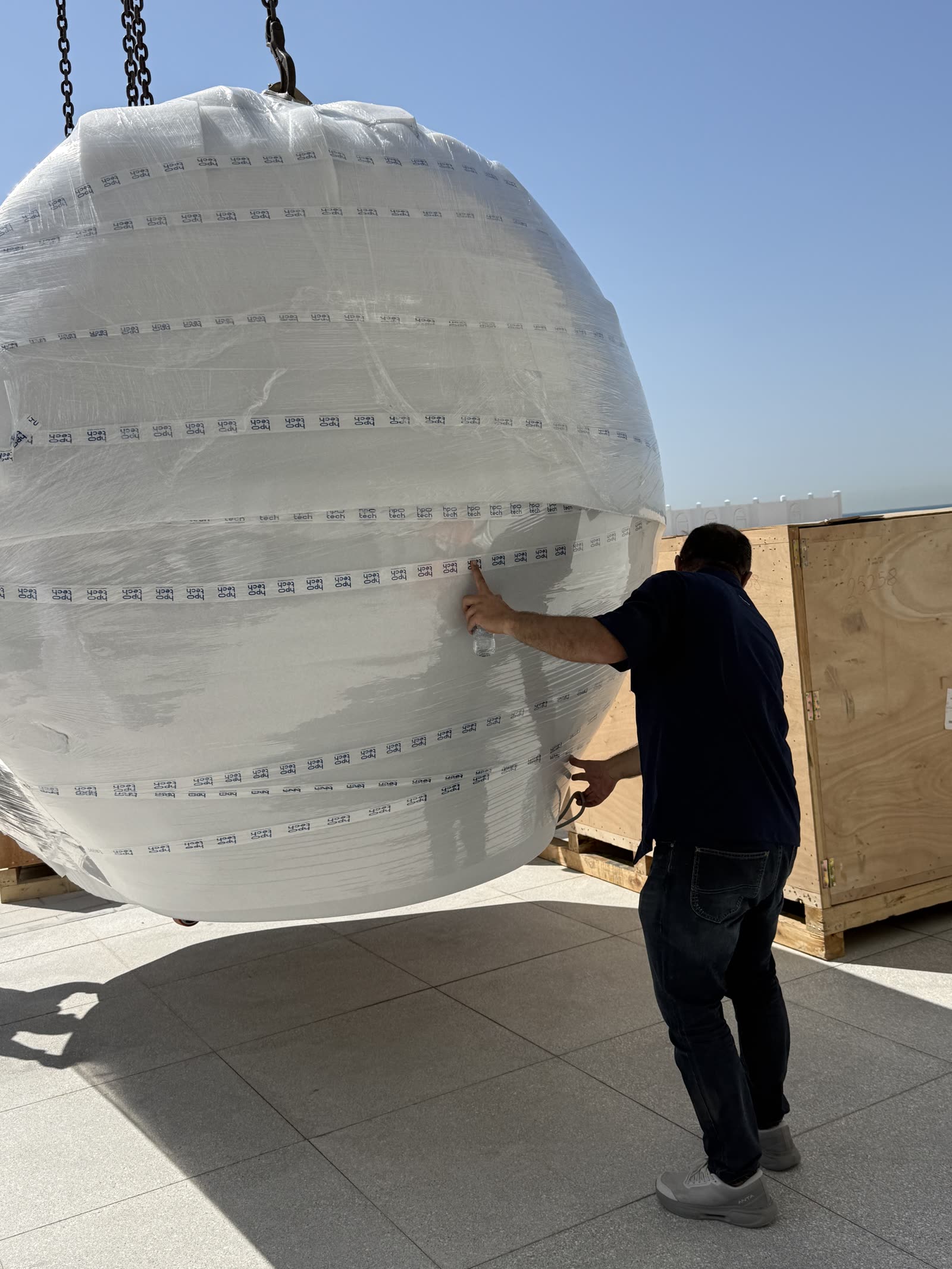 Chamber lifted into position during installation