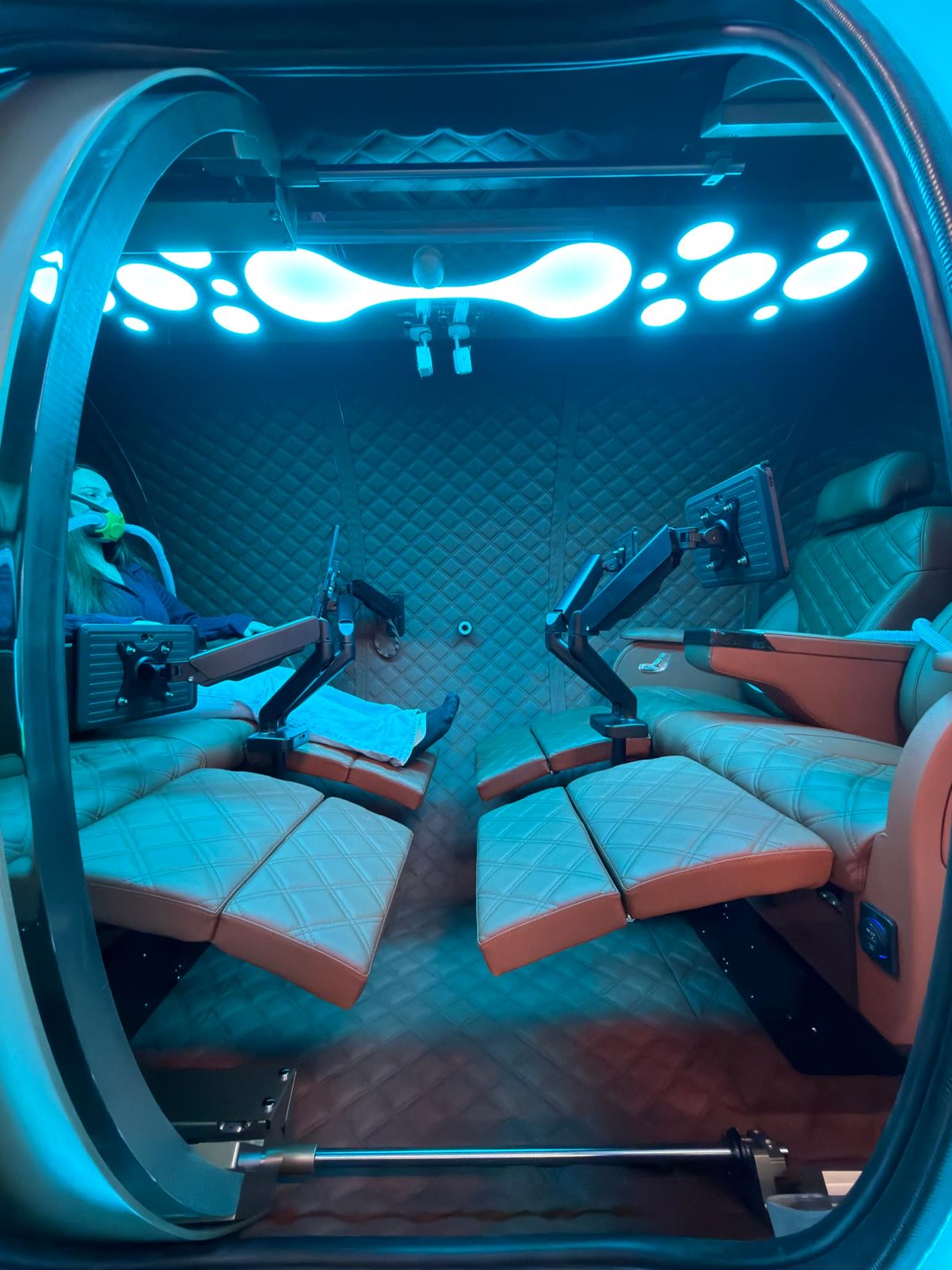 Quilted leather twin-seat chamber interior with treatment lighting
