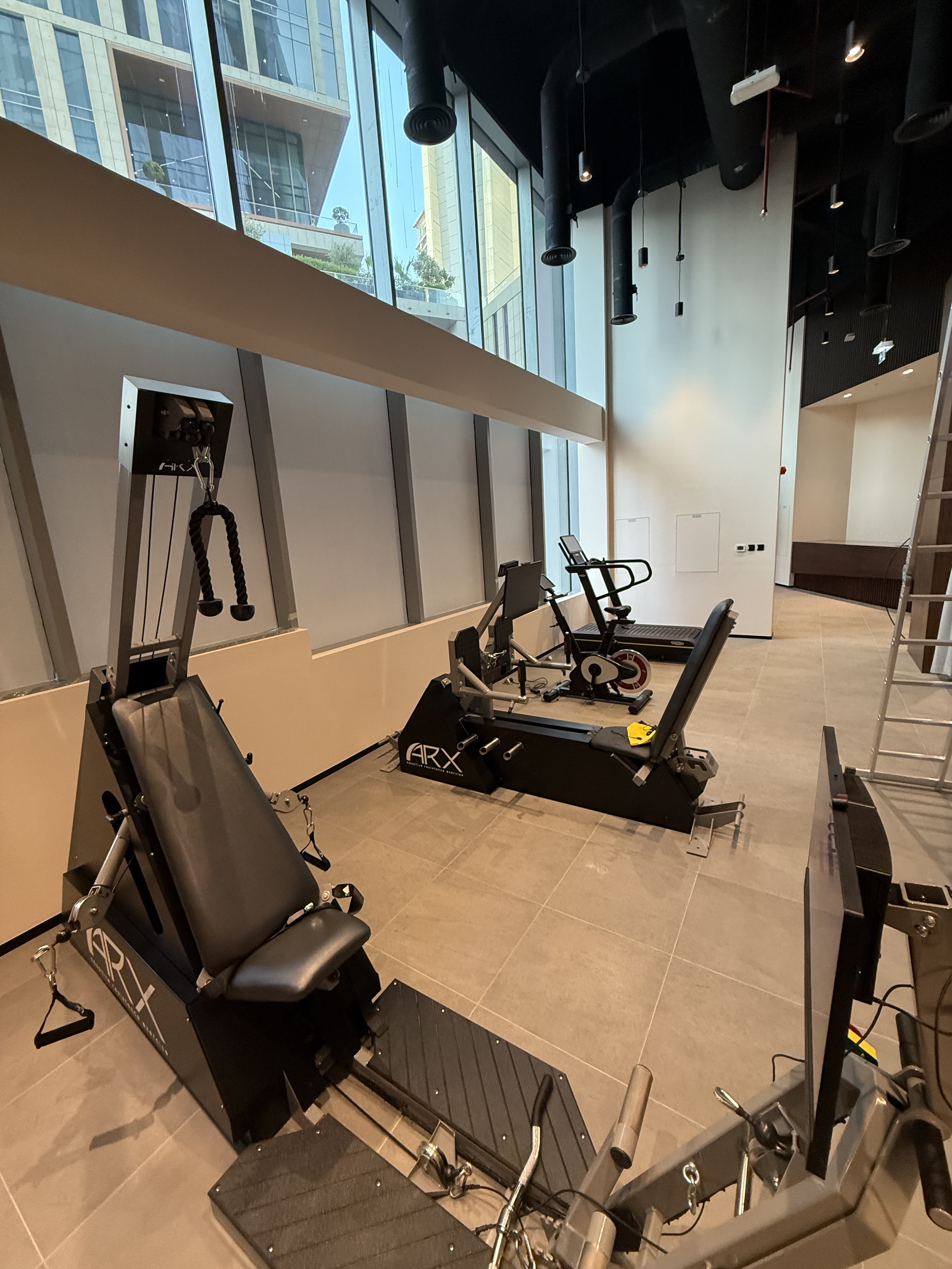 Strength equipment being positioned on the training floor during fit-out