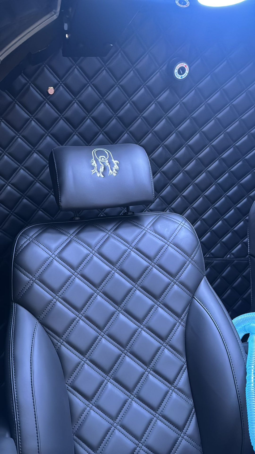 Quilted leather interior and embroidered headrest